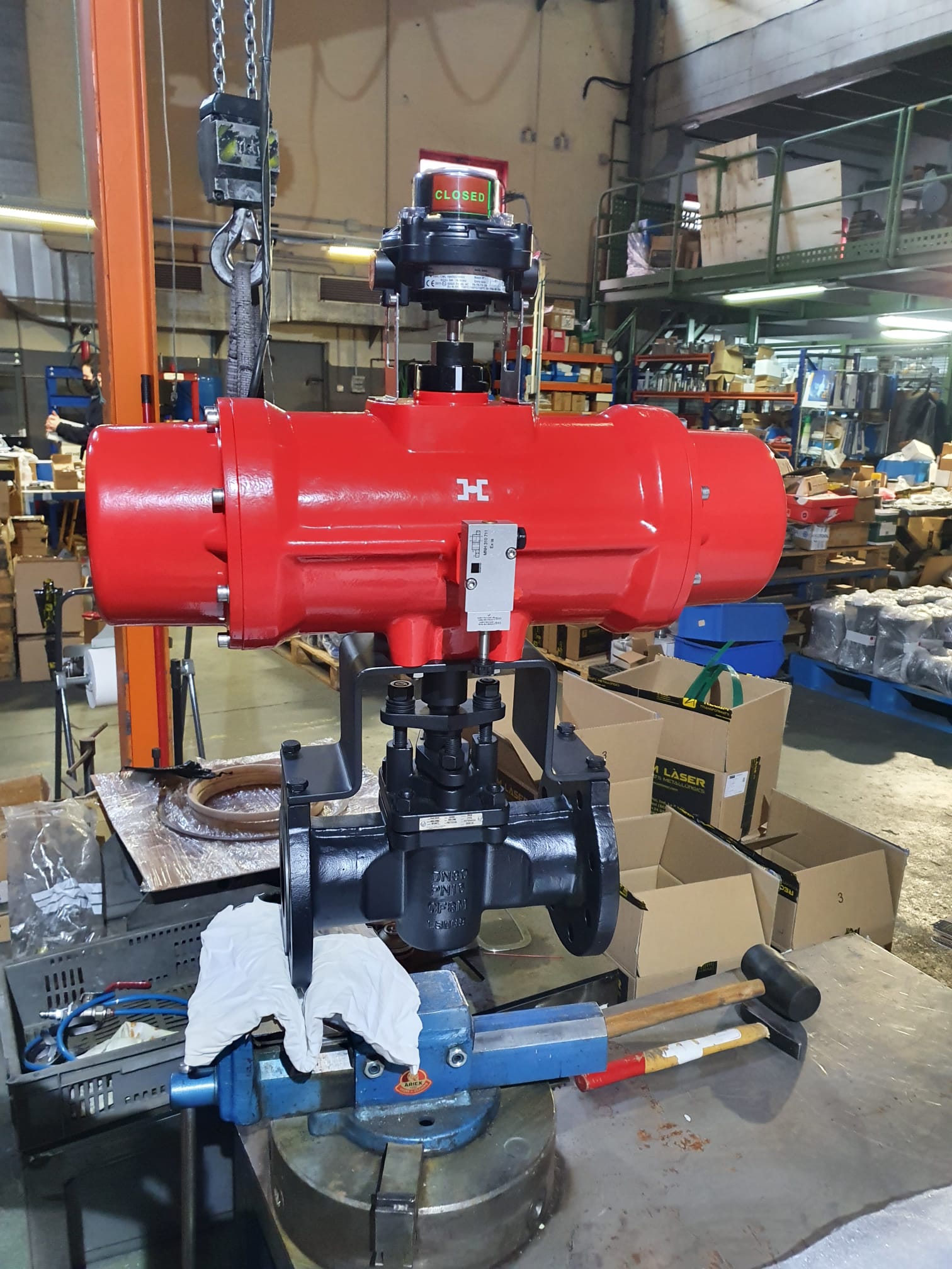 Automated plug valve with a red spring-return pneumatic actuator and limit switch box